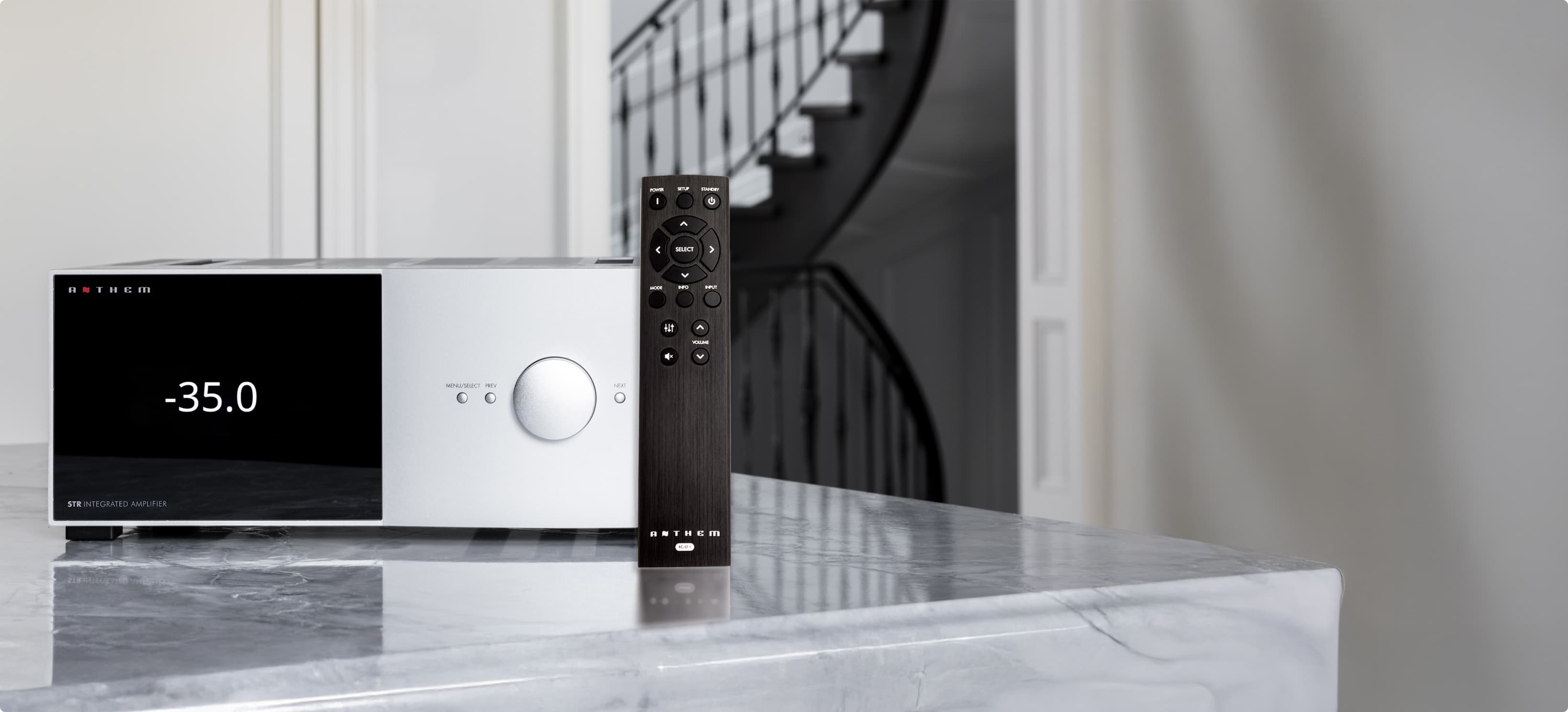 STR Integrated front panel in silver with accompanying remote control